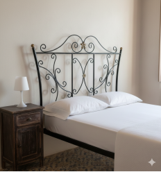 cabecero de forja rizos